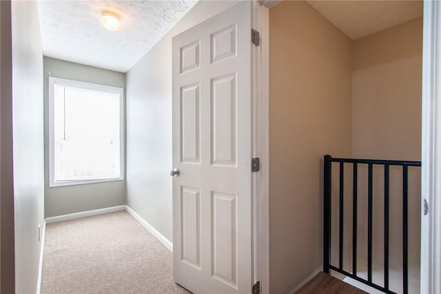 303 N Ross Ave Unit 215, Auburn, AL 36830 - corridor with a textured ceiling and carpet floors