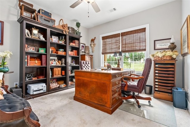 office space with ceiling fan and light colored carpet