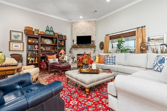 living room featuring crown molding and a fireplace