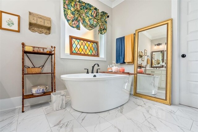 bathroom featuring crown molding and a bath