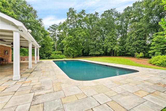 1601 Tanyard Rd, Lanett, AL 36863 - outdoor pool with a patio area, a ceiling fan, and view of wooded area