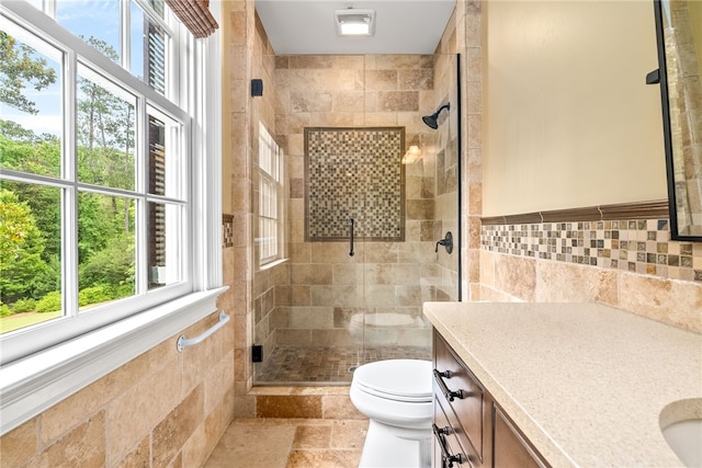1601 Tanyard Rd, Lanett, AL 36863 - bathroom featuring vanity, healthy amount of natural light, a stall shower, tile walls, and stone tile flooring