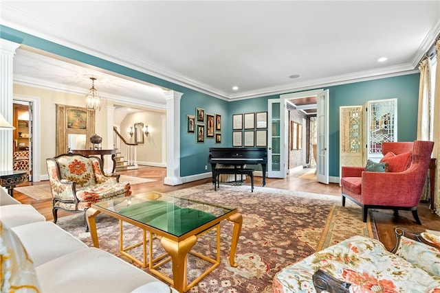 1601 Tanyard Rd, Lanett, AL 36863 - living room featuring decorative columns, stairs, ornamental molding, wood finished floors, and recessed lighting
