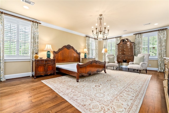 1601 Tanyard Rd, Lanett, AL 36863 - bedroom with a chandelier, multiple windows, wood finished floors, and ornamental molding