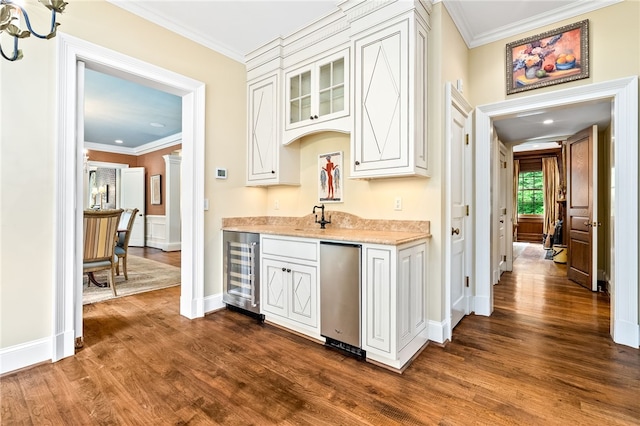 1601 Tanyard Rd, Lanett, AL 36863 - indoor wet bar featuring wine cooler, ornamental molding, refrigerator, dark wood finished floors, and a chandelier