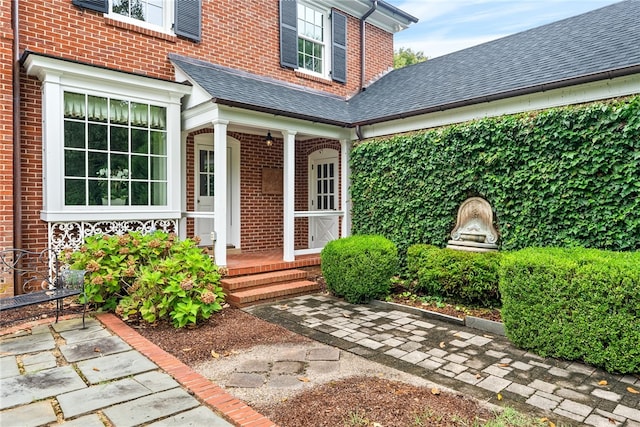 1601 Tanyard Rd, Lanett, AL 36863 - entrance to property with a shingled roof, brick siding, and covered porch