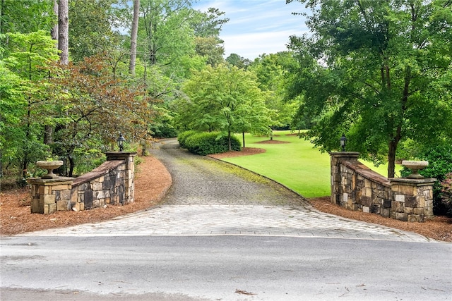 1601 Tanyard Rd, Lanett, AL 36863 - surrounding community with driveway and a lawn