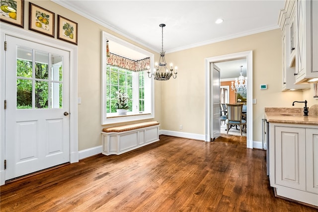 1601 Tanyard Rd, Lanett, AL 36863 - unfurnished dining area with a chandelier, dark wood finished floors, and crown molding
