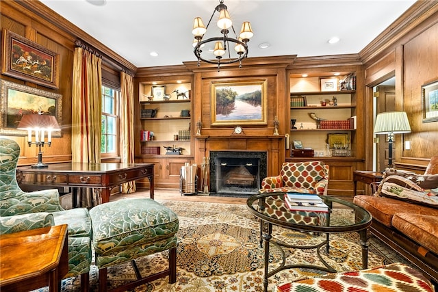 1601 Tanyard Rd, Lanett, AL 36863 - living area featuring ornamental molding, wood walls, built in features, a chandelier, and a high end fireplace