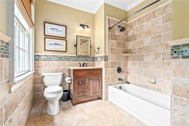 1601 Tanyard Rd, Lanett, AL 36863 - bathroom featuring tile walls, crown molding, vanity, tub / shower combination, and stone finish flooring