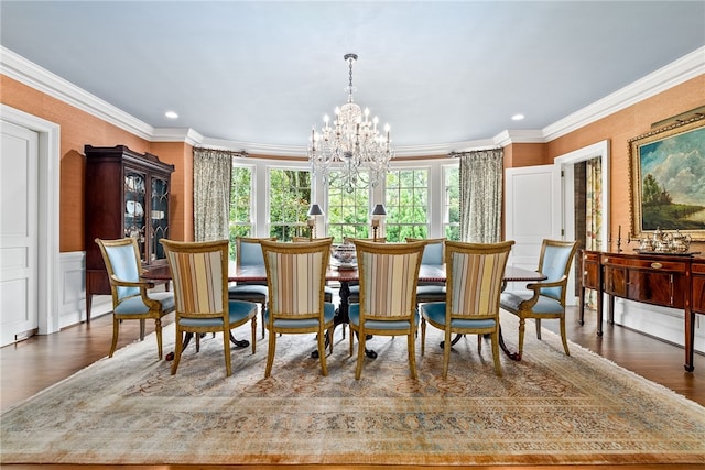 1601 Tanyard Rd, Lanett, AL 36863 - dining area featuring a chandelier, wood finished floors, crown molding, recessed lighting, and wainscoting