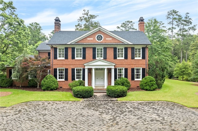 1601 Tanyard Rd, Lanett, AL 36863 - georgian-style home with a chimney, brick siding, a front lawn, and crawl space