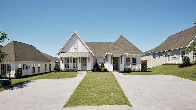 view of front of home featuring french doors and a front yard