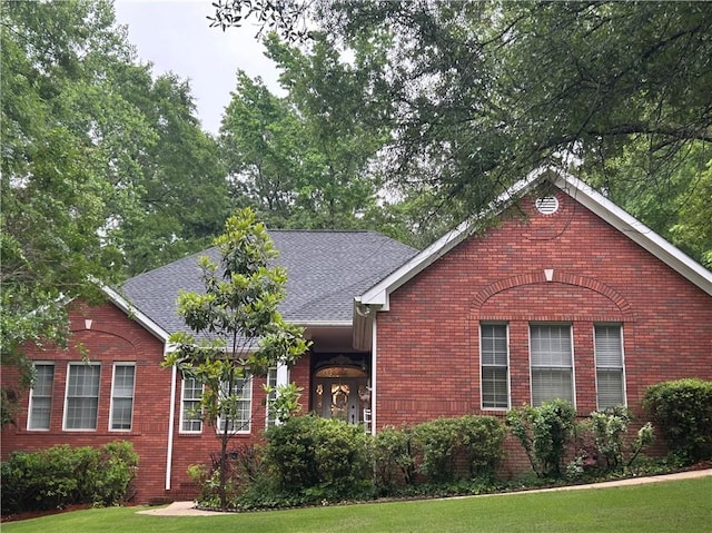 1894 Hillton Ct, Auburn, AL 36830 - ranch-style house with a shingled roof, brick siding, and a front lawn