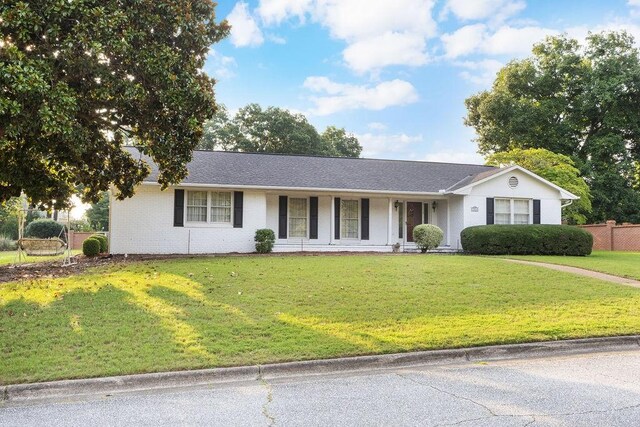 5004 22nd Ave, Phenix City, AL 36867 - ranch-style home featuring brick siding and a porch