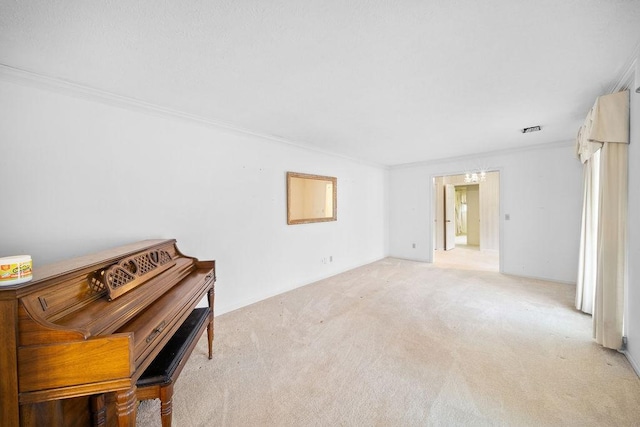 5004 22nd Ave, Phenix City, AL 36867 - carpeted spare room featuring crown molding and a chandelier