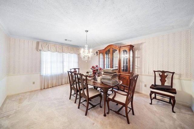 5004 22nd Ave, Phenix City, AL 36867 - dining area featuring a chandelier, wallpapered walls, ornamental molding, light carpet, and a textured ceiling