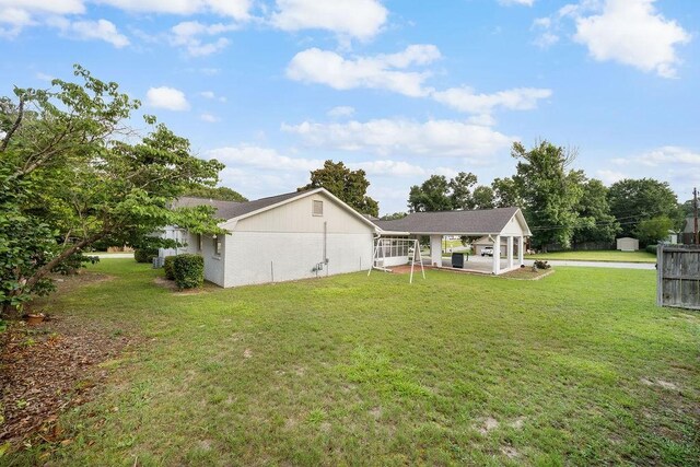 5004 22nd Ave, Phenix City, AL 36867 - back of house with a yard and a patio