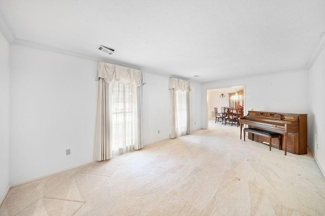 5004 22nd Ave, Phenix City, AL 36867 - carpeted living area with ornamental molding and a chandelier