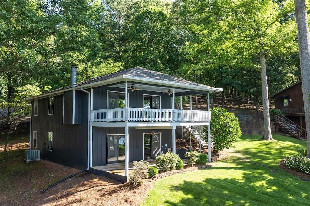 back of house with a lawn, ceiling fan, a patio area, and central air condition unit