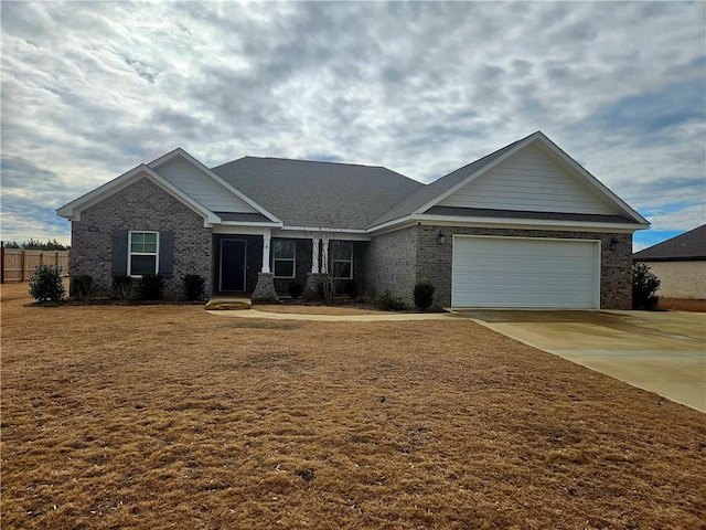 view of front facade with a garage and a front yard