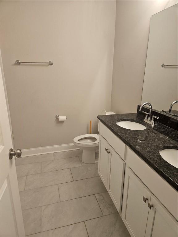 bathroom with vanity and toilet