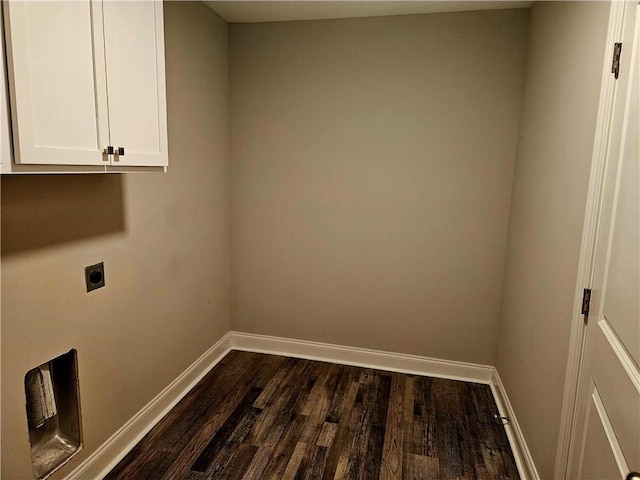 laundry room featuring cabinets, hookup for an electric dryer, and dark hardwood / wood-style flooring