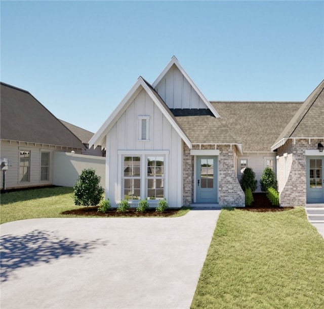 03244 Bradley Ln, Auburn, AL 36830 - view of front of home featuring board and batten siding, a shingled roof, and brick siding