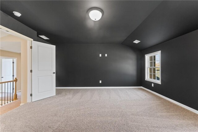 42 Lee Road 2234, Smiths Station, AL 36877 - carpeted empty room featuring lofted ceiling and baseboards