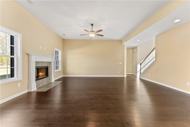 42 Lee Road 2234, Smiths Station, AL 36877 - unfurnished living room featuring ceiling fan, a fireplace, dark wood-type flooring, stairway, and recessed lighting