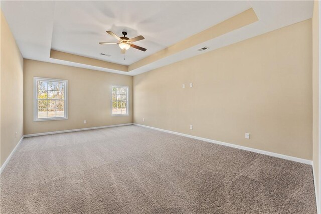 42 Lee Road 2234, Smiths Station, AL 36877 - carpeted empty room with a tray ceiling and a ceiling fan