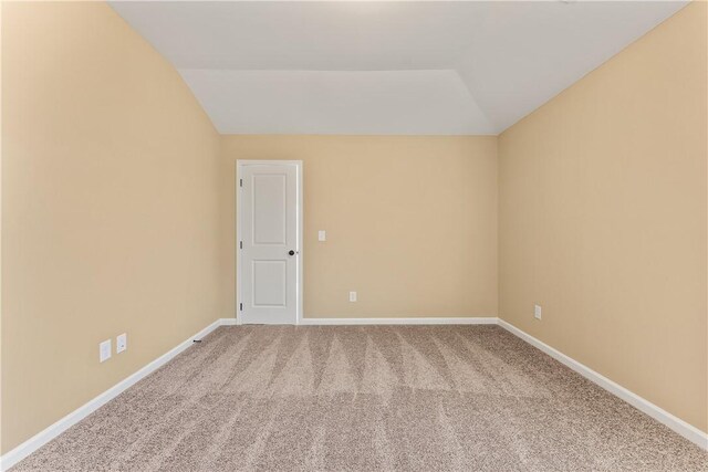 42 Lee Road 2234, Smiths Station, AL 36877 - carpeted spare room featuring vaulted ceiling and baseboards