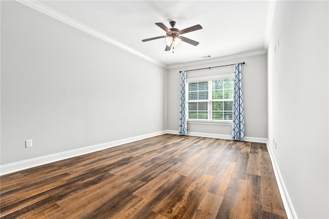 empty room featuring a ceiling fan, dark wood-style floors, baseboards, visible vents, and ornamental molding