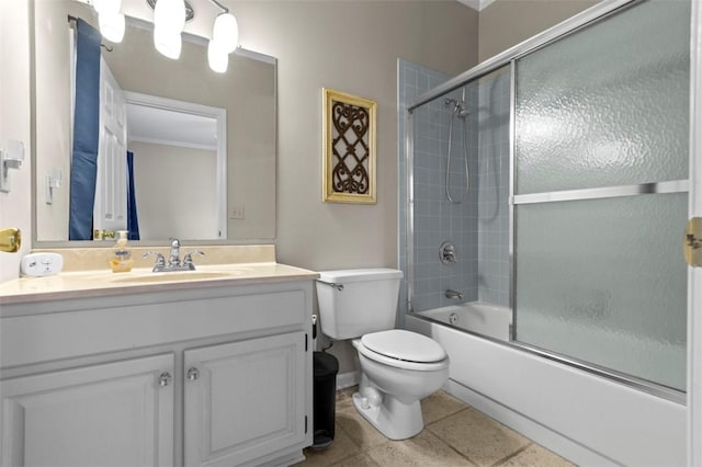 bathroom featuring enclosed tub / shower combo, tile patterned flooring, vanity, and toilet