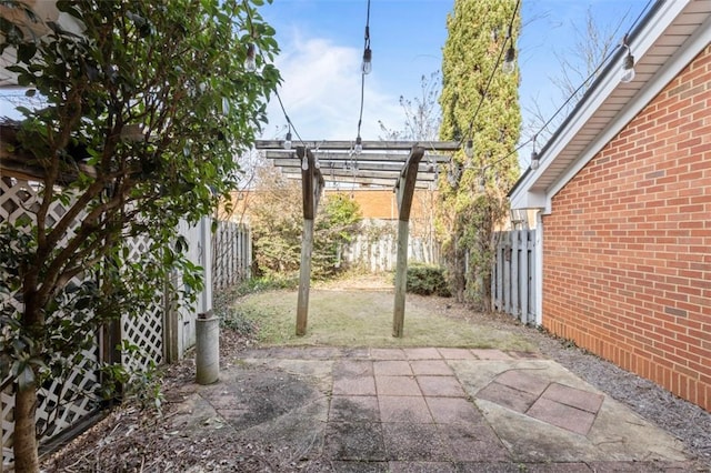 view of patio featuring a fenced backyard and a pergola