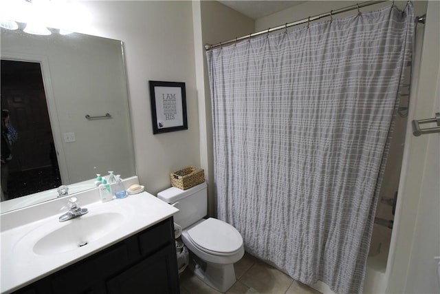 full bathroom with tile patterned floors, vanity, shower / tub combo, and toilet