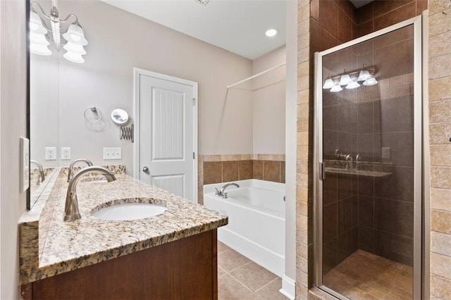 2514 Churchill Cir, Auburn, AL 36832 - bathroom featuring a stall shower, a bath, tile patterned flooring, and double vanity