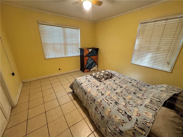 bedroom with ceiling fan, light tile patterned flooring, and crown molding