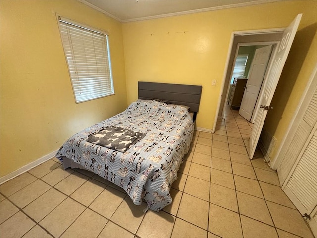 tiled bedroom featuring crown molding