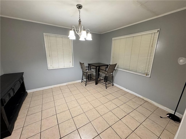 dining area featuring light tile patterned flooring, ornamental molding, and an inviting chandelier