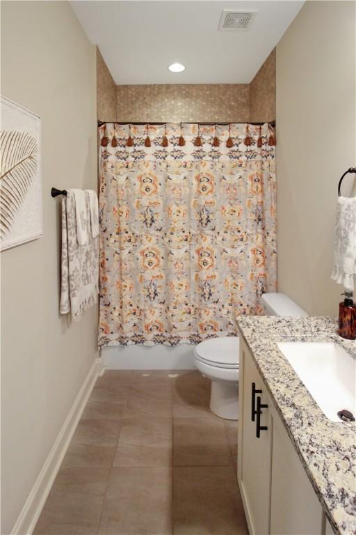 3855 Academy Dr Unit 402, Opelika, AL 36801 - bathroom featuring vanity, shower / bath combination with curtain, and tile patterned floors