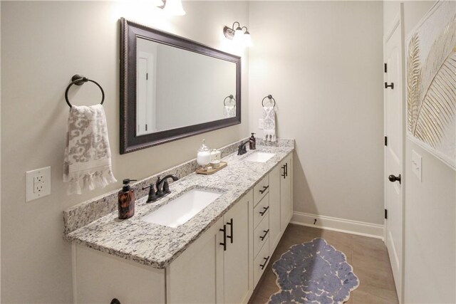 3855 Academy Dr Unit 402, Opelika, AL 36801 - full bathroom featuring double vanity and wood finished floors