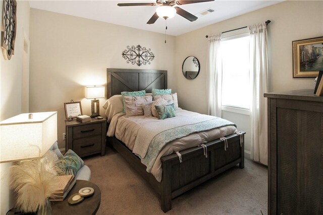 3855 Academy Dr Unit 402, Opelika, AL 36801 - bedroom featuring light carpet and ceiling fan