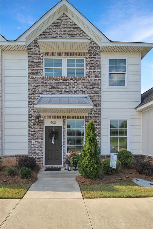 3855 Academy Dr Unit 402, Opelika, AL 36801 - view of front facade with brick siding
