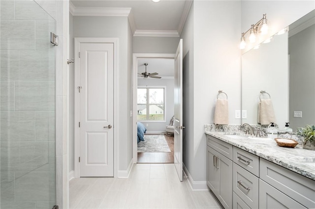 bathroom featuring vanity, ornamental molding, ceiling fan, and a tile shower