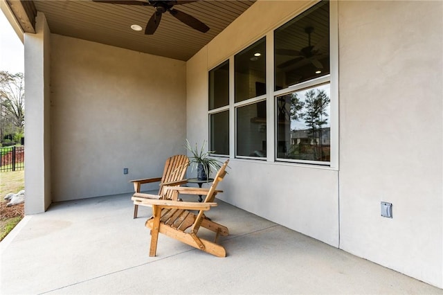 view of patio featuring ceiling fan