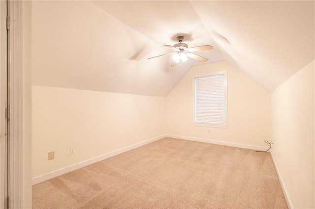 bonus room with ceiling fan, light colored carpet, and lofted ceiling