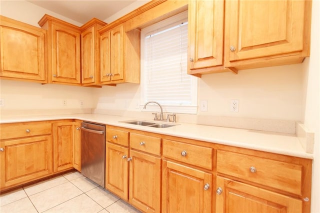 kitchen featuring dishwasher, light tile patterned floors, and sink