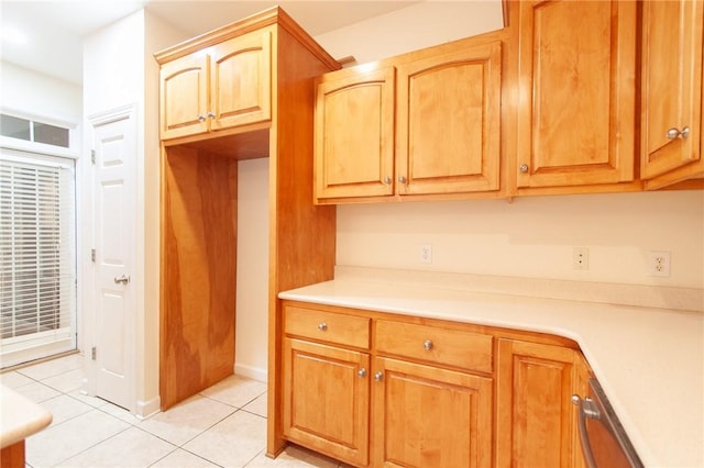 kitchen with dishwasher and light tile patterned floors