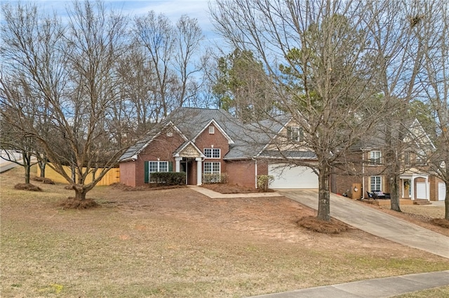 view of front facade with a garage and a front yard